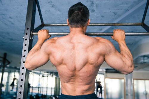 Man performing chin-ups